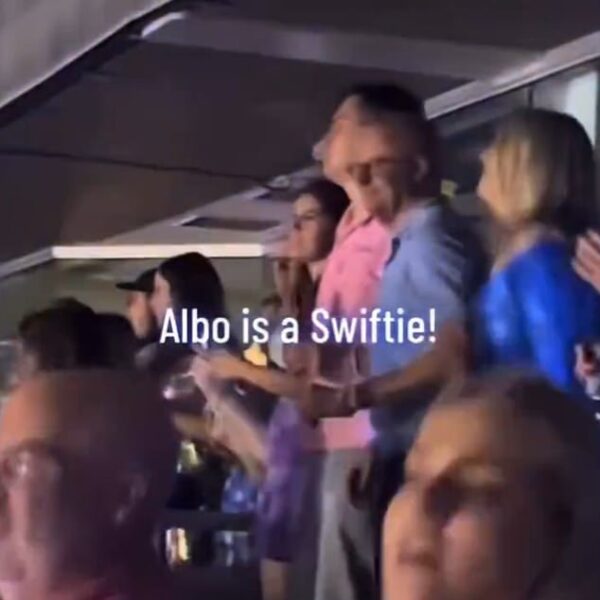 Mr Albanese is seen (blue top) at Friday night's Taylor Swift show in Sydney, in between his son Nathan and fiancee Jodie Haydon
