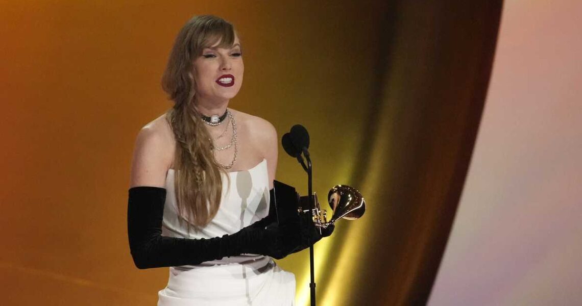 Taylor Swift wins album of the year at the Grammy Awards for the fourth time, setting a new record