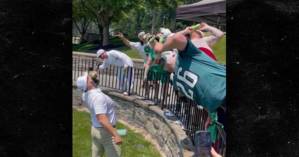 Jason Kelce Shotguns Beers With Fans At Charity Golf Tournament