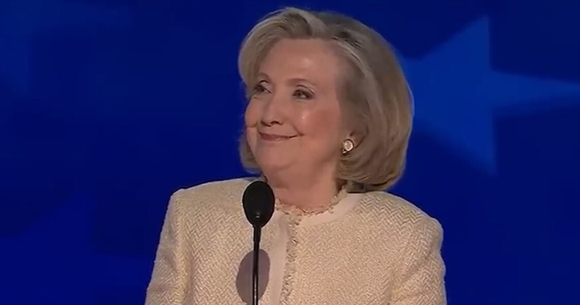 Hillary Clinton Smiles During ‘Lock Him Up’ Chant Against Trump at DNC