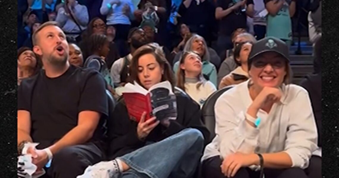 Aubrey Plaza Pretends To Read Book During WNBA Finals